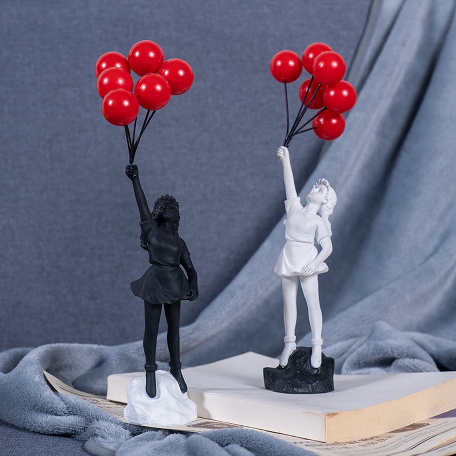 Girl Holding Flying Balloons Sculpture