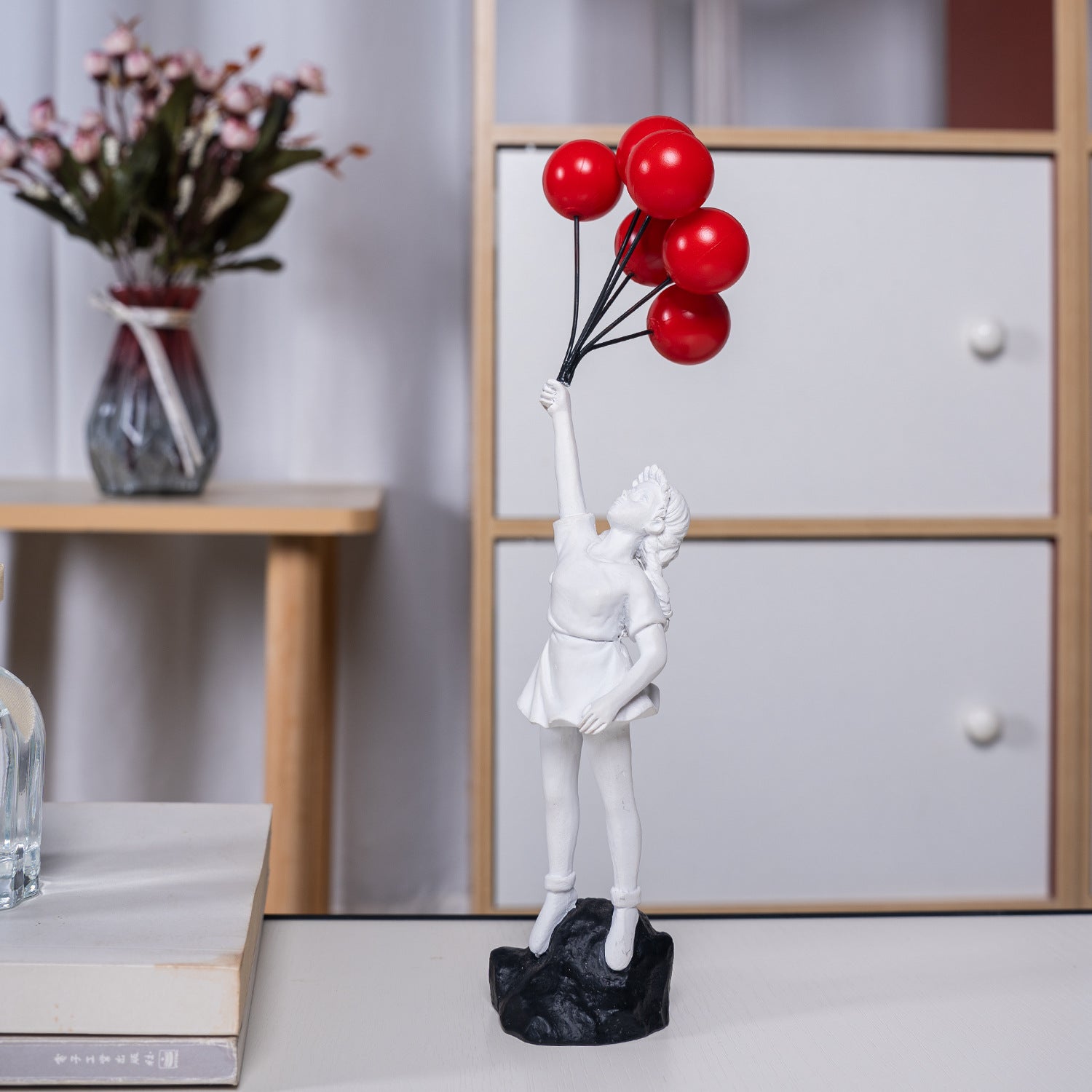 Girl Holding Flying Balloons Sculpture