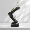 Reaching Summits Through Education Sculpture