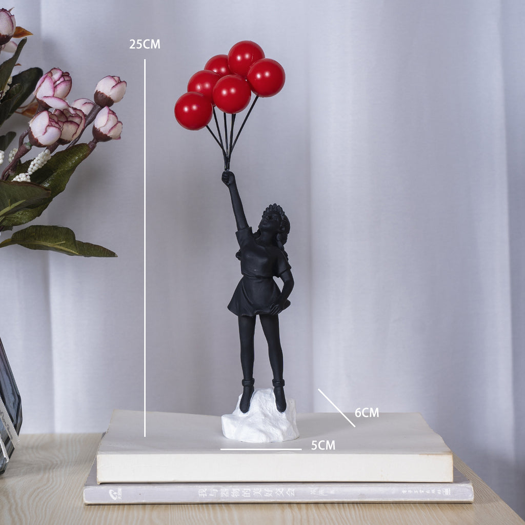 Girl Holding Flying Balloons Sculpture